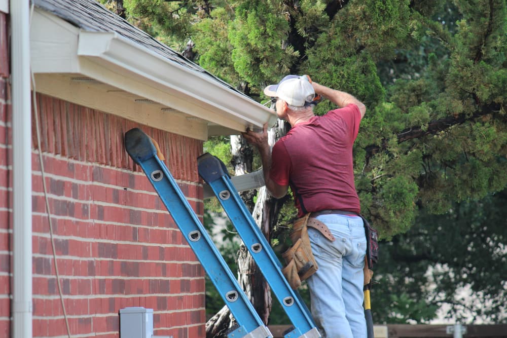 man-fixing-gutter